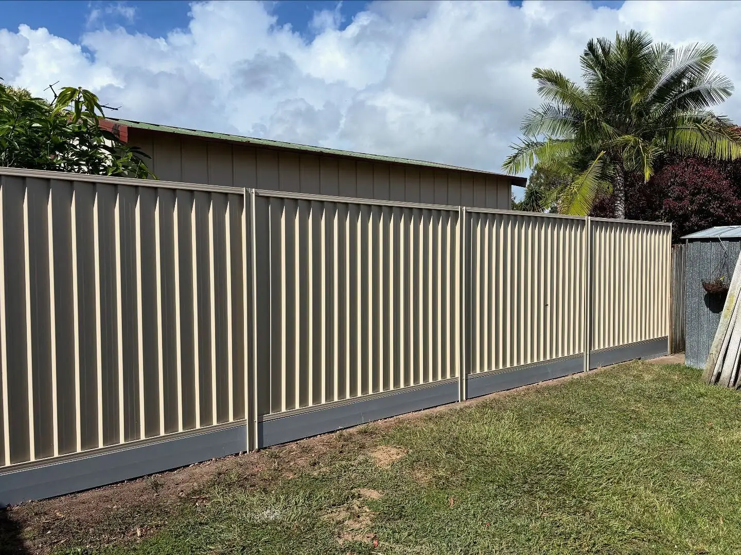 Cream Colorbond fence with neat panels and capping