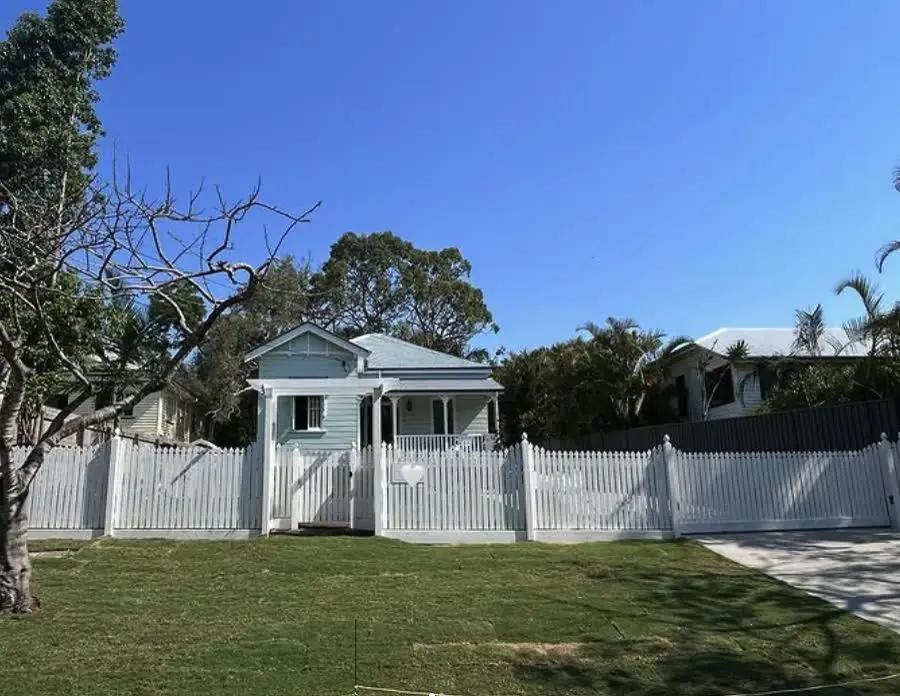 Heritage cottage with white picket boundary